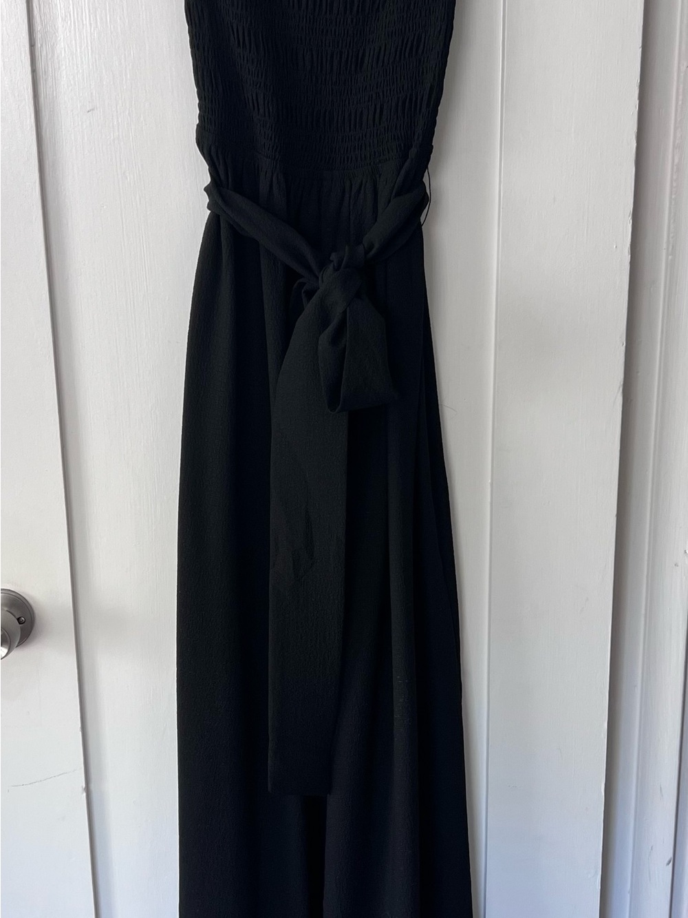Women’s black wide leg jumpsuit with spaghetti straps